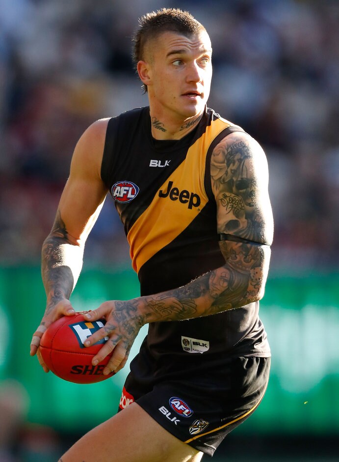 AFL 2016 Rd 17 - Richmond v Essendon MELBOURNE, AUSTRALIA - JULY 16: Dustin Martin of the Tigers in action during the 2016 AFL Round 17 match between the Richmond Tigers and the Essendon Bombers at the Melbourne Cricket Ground on July 16, 2016 in Melbourne, Australia. (Photo by Adam Trafford/AFL Media)